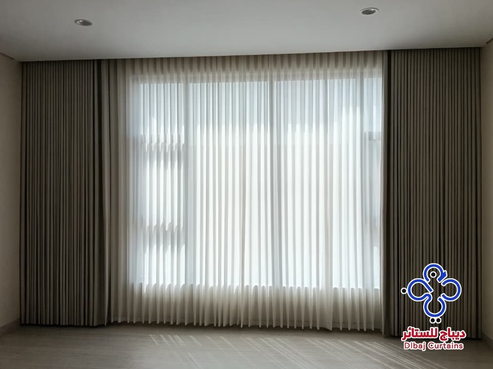 Full-height curtains installed by Dibaj Curtains